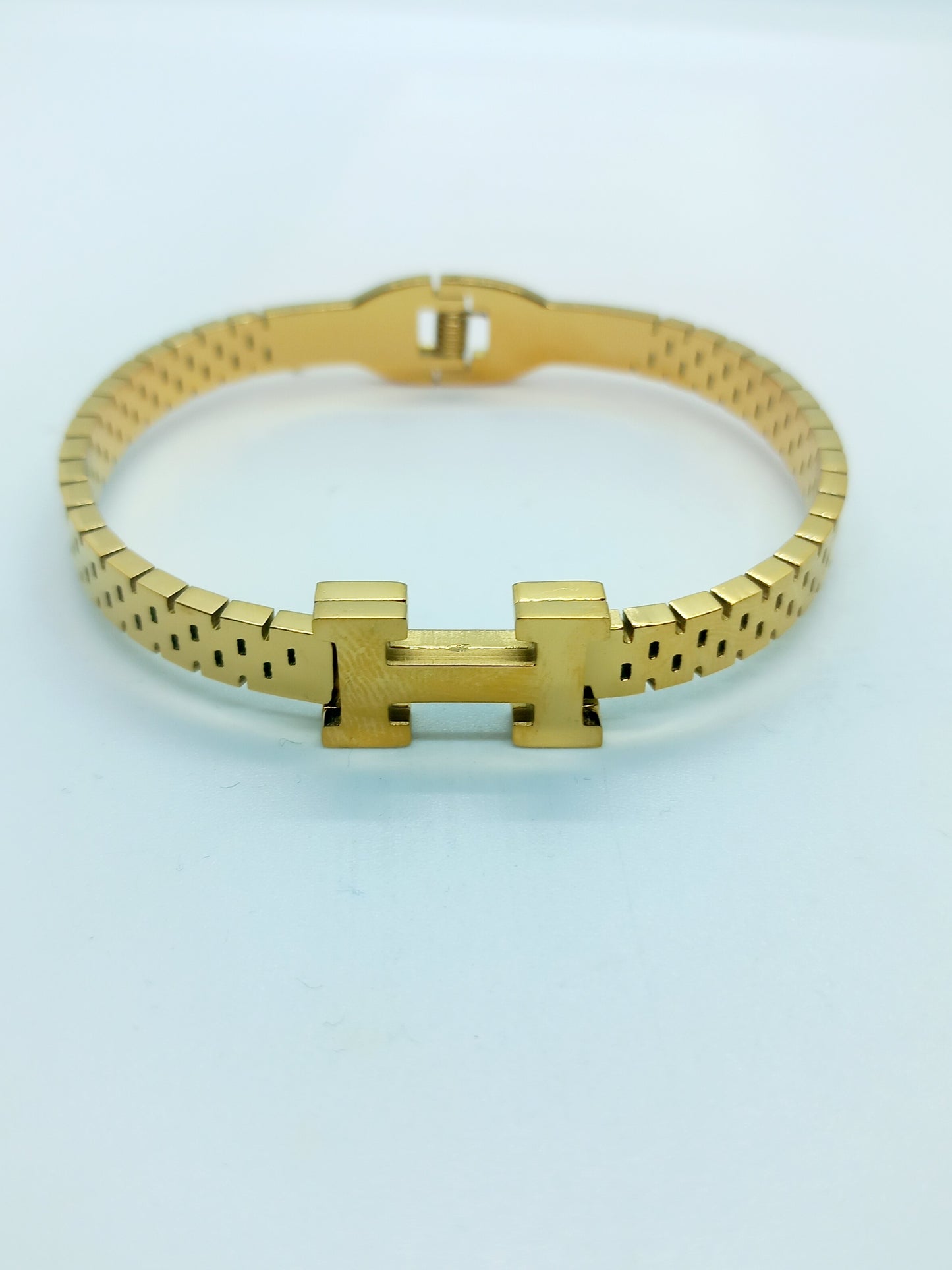 Bracelet H doré en acier inoxydable