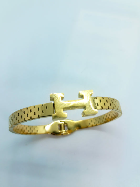 Bracelet H doré en acier inoxydable